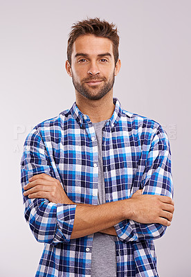 Buy stock photo Portrait, arms crossed and man in studio for fashion isolated on a gray background. Cool person, face and confidence in casual clothes for trendy style in shirt outfit on a backdrop in Australia