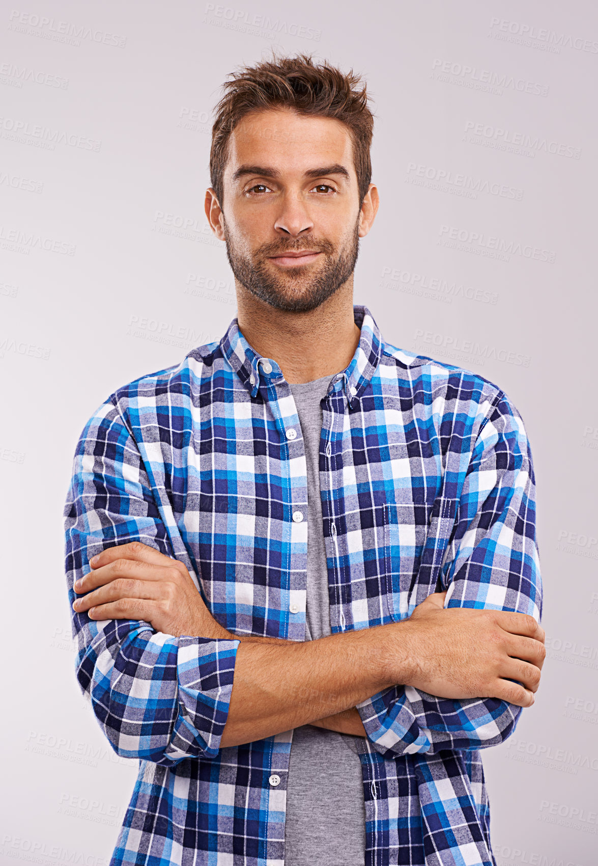 Buy stock photo Portrait, arms crossed and man in studio for fashion isolated on a gray background. Cool person, face and confidence in casual clothes for trendy style in shirt outfit on a backdrop in Australia