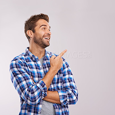 Buy stock photo Laugh, presentation and casual man in studio with smile, deal announcement or happy face of professional. Showing, advice and creative person pointing at offer, notification or white background space