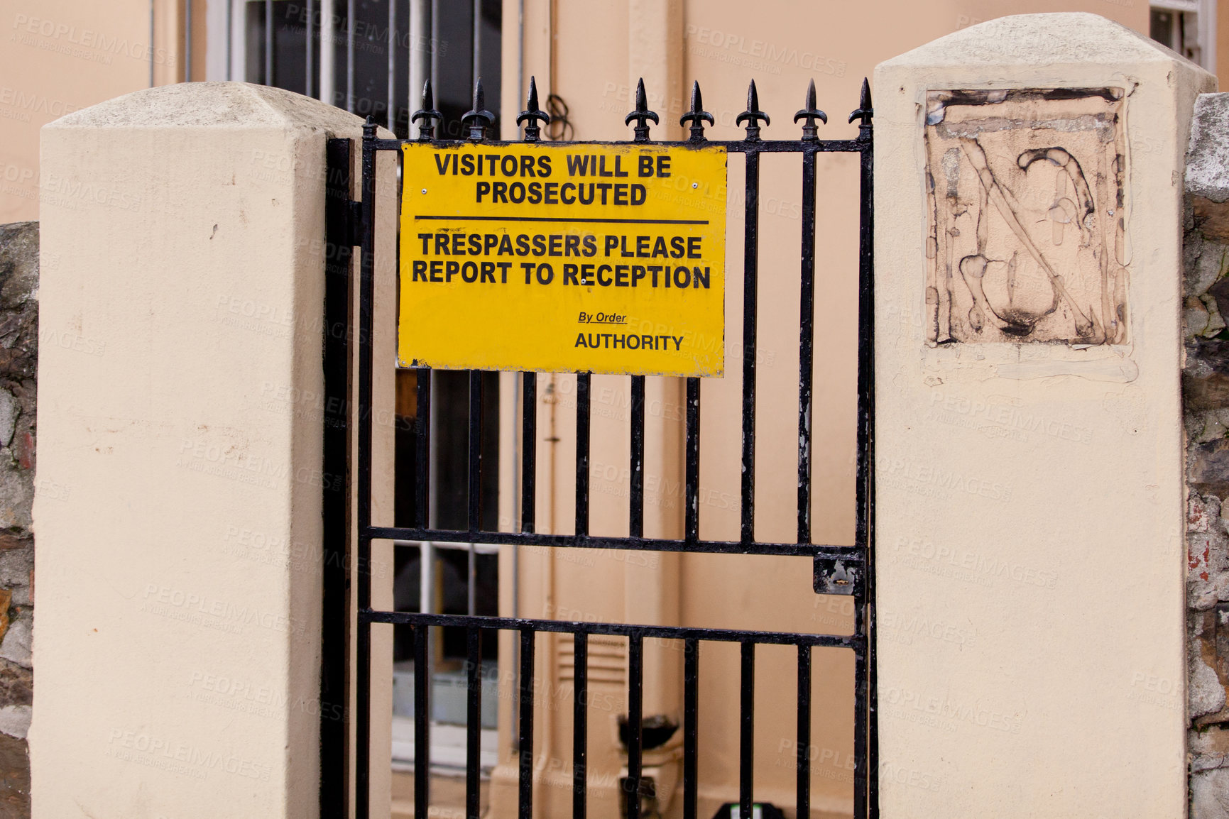 Buy stock photo Sign, outdoor and warning with gate, building and authority with board and street with design. Notice, urban town and outside with road or safety with protection and review with information or poster