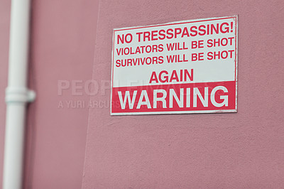 Buy stock photo Comic, warning and sign on wall of property for caution, funny notification and information. Public signage, symbol and building with board, poster and joke for attention, security and safety message