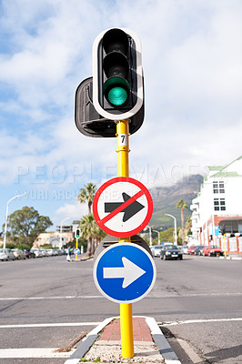 Buy stock photo Road sign, traffic light and signage in street for direction with attention notification and arrow symbol outdoor in city. Board, public notice and signpost for route, alert message and advertisement