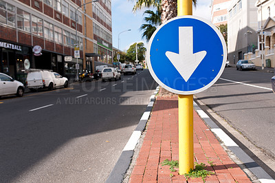 Buy stock photo Road sign, blue arrow and signage in street for direction with attention notification and symbol outdoor in city. Board, public notice and signpost for driver, alert message and advertisement in town