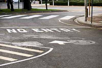 Buy stock photo Road marking, no entry and warning with text, arrow and error for direction with paint on asphalt in city. Ground, street and mistake with language, funny typo and comic joke with symbol in Cape Town