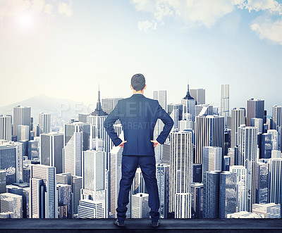 Buy stock photo Back, view of the city and a business man standing hands on hips outdoor with a vision or mindset of success. Proud sky and buildings with a male corporate employee looking out over an urban town