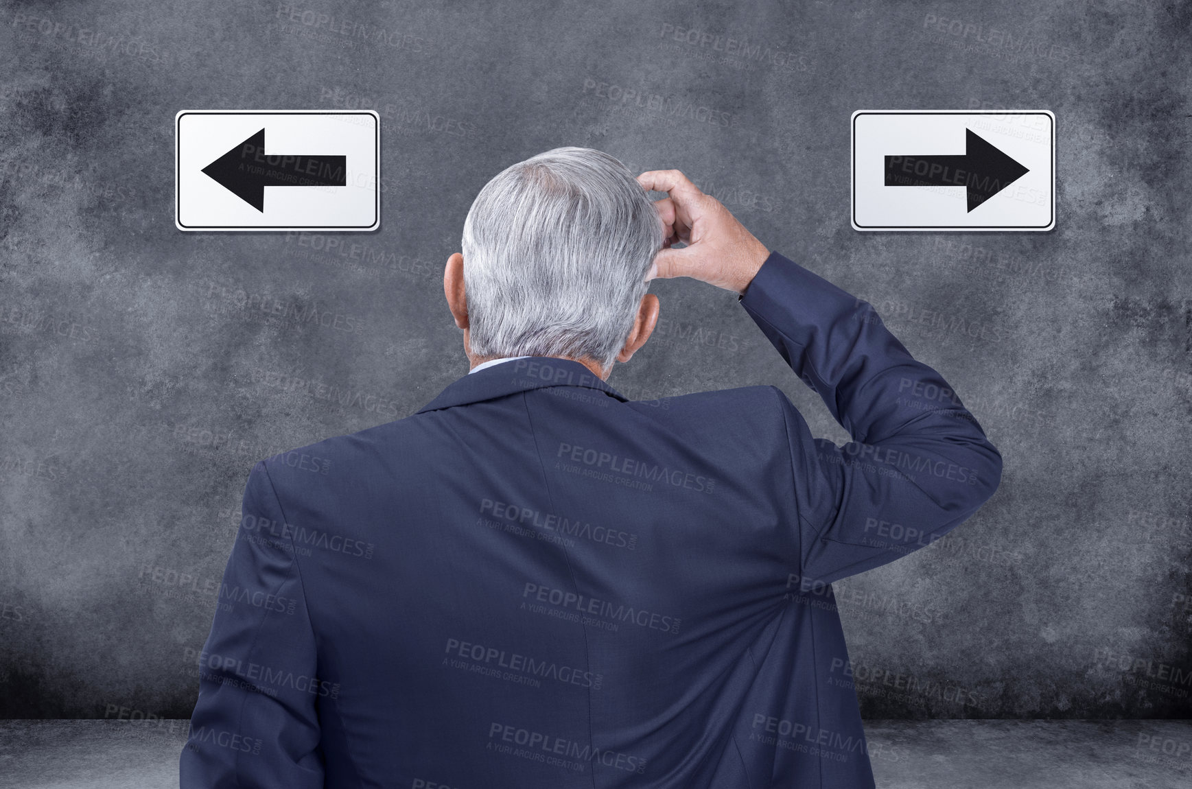 Buy stock photo A rear view of thinking, confused and deciding businessman struggling and trying to decide which way to go. Indecisive corporate worker chooses direction with left and right arrow sign on black wall