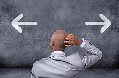 Buy stock photo Business, chalkboard and black man with a decision, arrows and choices for career development, opportunity and confusion. Male employee, consultant or entrepreneur with symbol and icons for direction