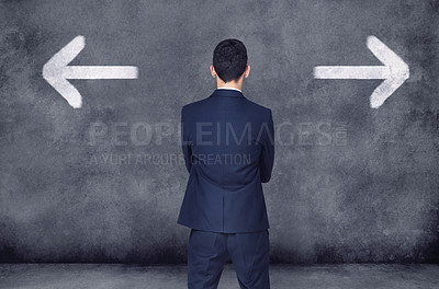 Buy stock photo Back, business and man with decision, opportunity and choice with startup, arrows and chalkboard. Male person, employee and entrepreneur with ideas, confused and consultant with formal wear or a suit