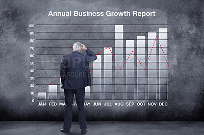 Buy stock photo Back, business and man with graph, finance and profit growth against a chalkboard, thinking and stress. Mature male employee, accountant and investor with a chart, year and track progress for income