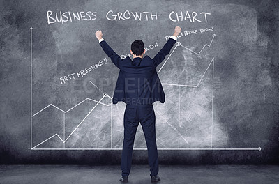 Buy stock photo Finance business man cheering in success looking at a cgi graph, chart and data against a black background. Boss analysing, examining and celebrating startup company growth from behind