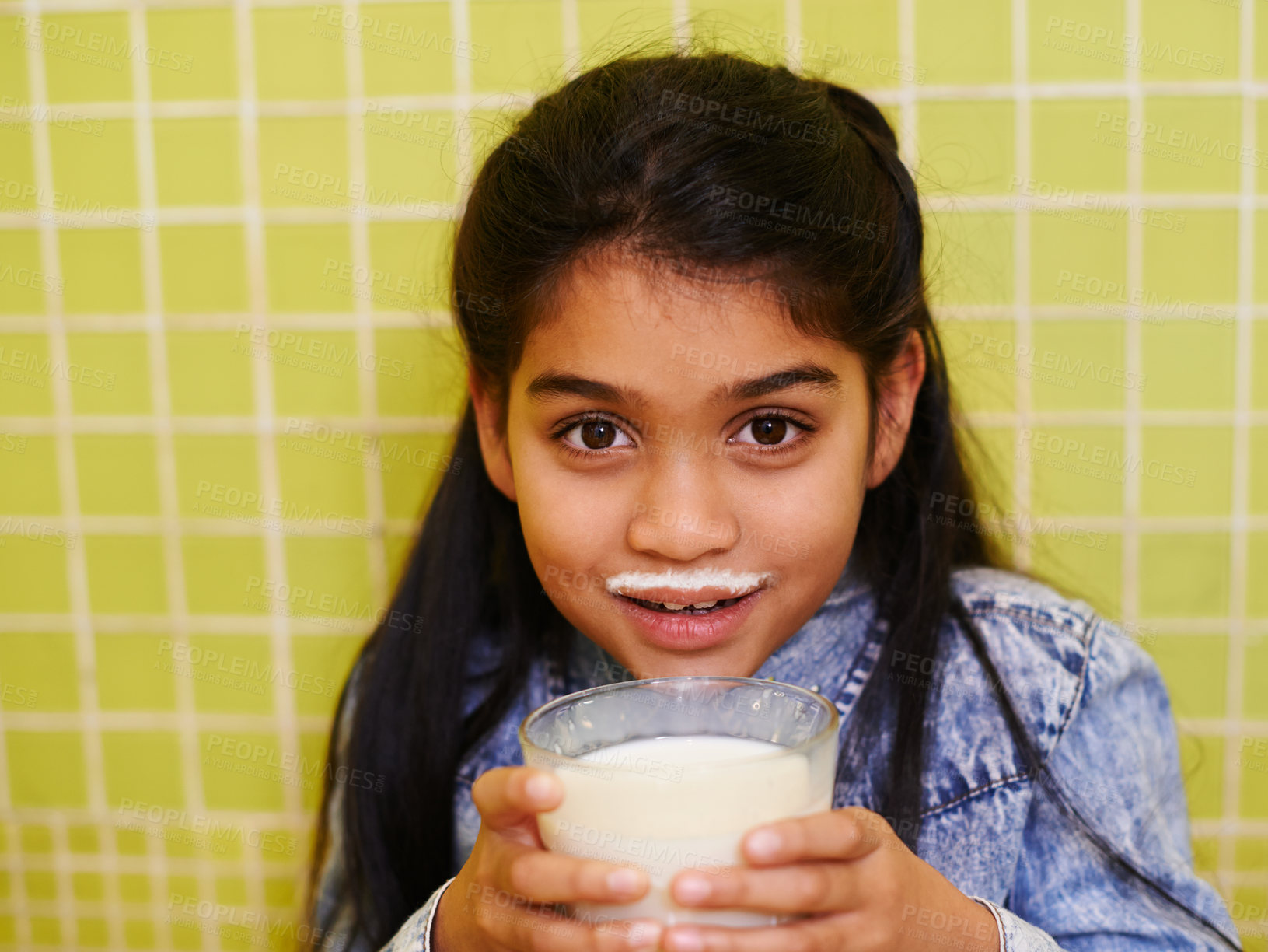 Buy stock photo Milk, moustache or girl child portrait in house with healthy breakfast drink on yellow wall background. Protein, dairy and face of kid in india with milkshake for balance, energy or calcium nutrition