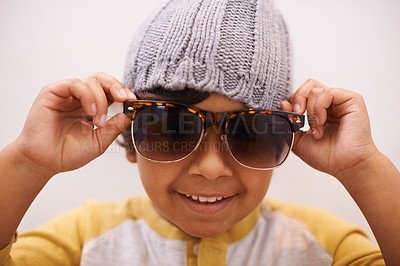 Buy stock photo Child, portrait and sunglasses with smile and confidence with kid in a home. Happy, eyewear and youth fashion with an hipster boy with modern and casual style in a house with confidence and frames