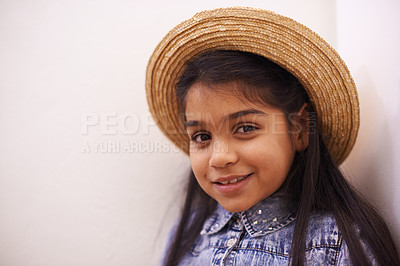 Buy stock photo Children, fashion and portrait of girl with hat at home with confidence, trend or cool personality on white wall background. Clothes, face or kid person smile with positive attitude, outfit or style