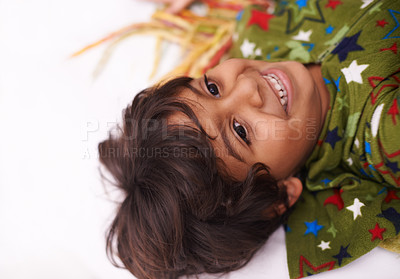 Buy stock photo Children, thinking and boy on a floor happy, chilling or imagine, playful or brainstorming at home. Night, smile and curious Indian kid in a living room in India with bedtime fun, memory or fantasy