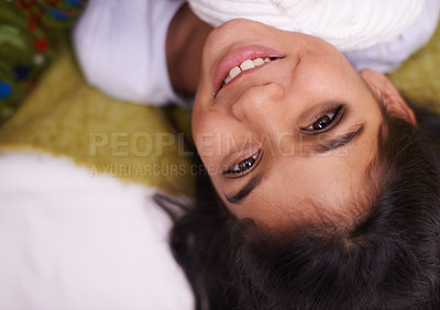 Buy stock photo Children, portrait and Indian girl on a floor happy, curious or imagine, playful or brainstorming at home. Night, fantasy and face of kid person in living room in India with bedtime, fun or smile