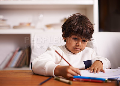 Buy stock photo Student, child and home for writing, learning or education in school books with color or drawing. Mexican boy or kid with pencil for language development, homework and creativity or solution at table