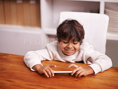 Buy stock photo Phone, search and happy boy kid in a kitchen for google it, gaming or sign up at home. Smartphone, smile and kid person in a house online for streaming, video or cartoon, film or Netflix and chill