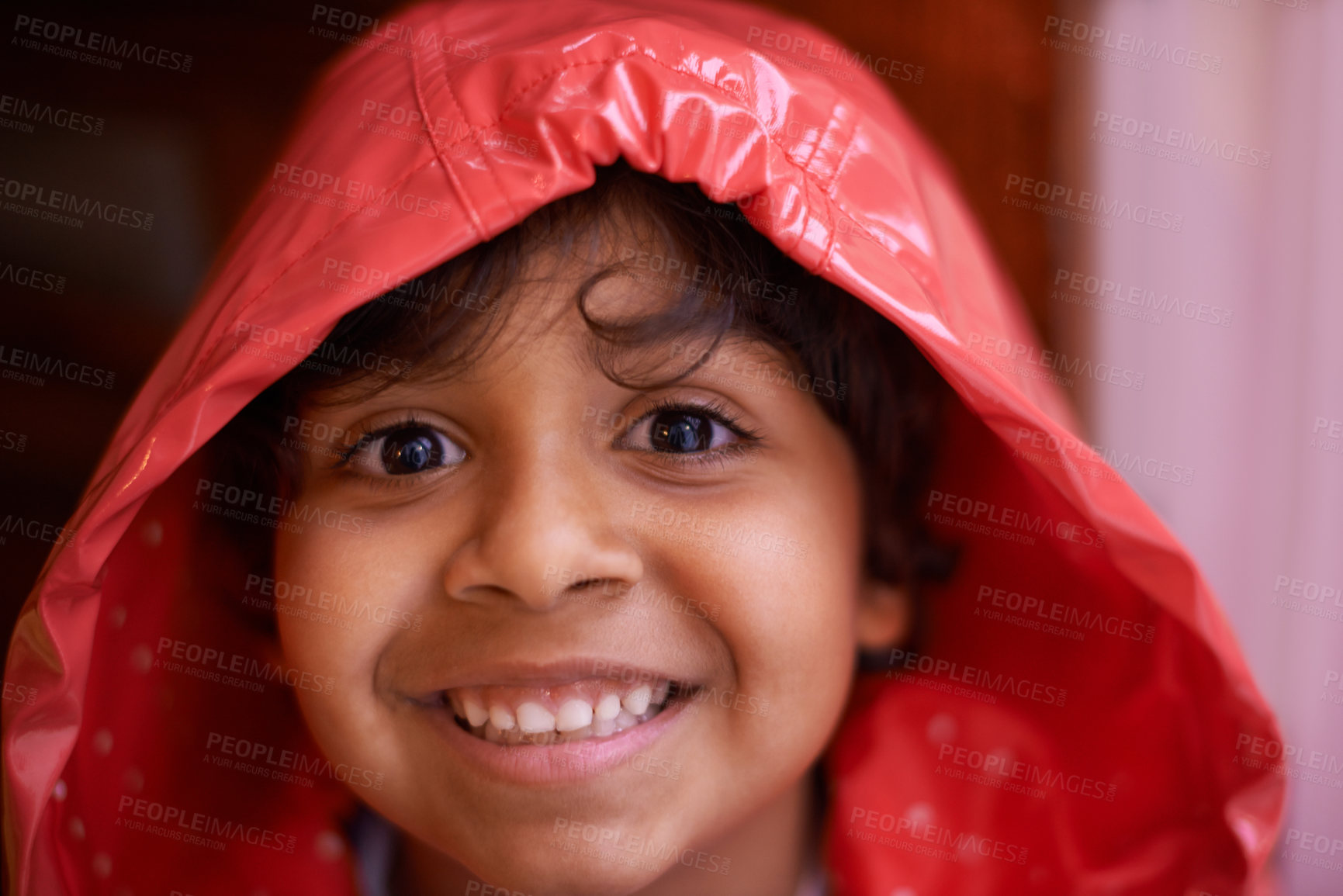 Buy stock photo Happy boy, portrait and fashion with red raincoat for rain, winter or cold season at home. Face of cute young child or kid with smile for protection, clothing or safety from rainy weather at house