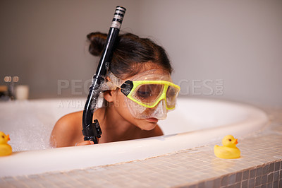 Buy stock photo Shot of a cute little girl wearing snorkeling gear in the bath