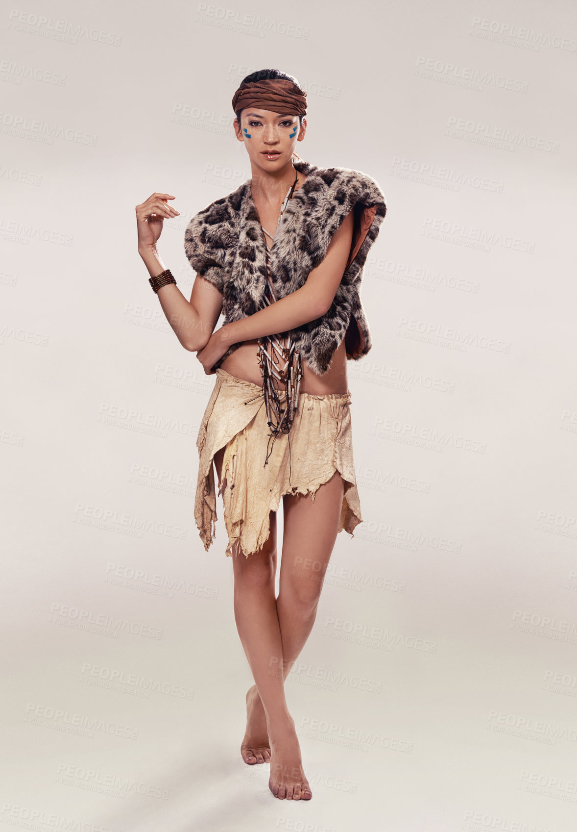 Buy stock photo A sultry young woman in native american-inspired clothing