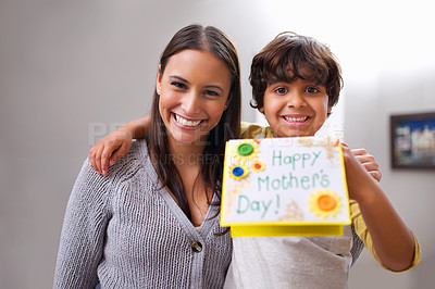 Buy stock photo Boy, mom and portrait with card for mothers day, giving and appreciation for love and kindness in house. Indian people, parent and child with smile and joy with gift for present, family and happy