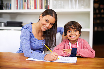 Buy stock photo Mother, child and portrait with book for homework, help and education for learning, study and development. Indian people, woman and boy with smile and pencil for teach, writing and grades in house
