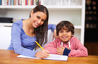 Buy stock photo Mother, child and portrait with book for homework, help and education for learning, study and development. Indian people, mom and boy with smile and pencil for teach, writing and grades in house