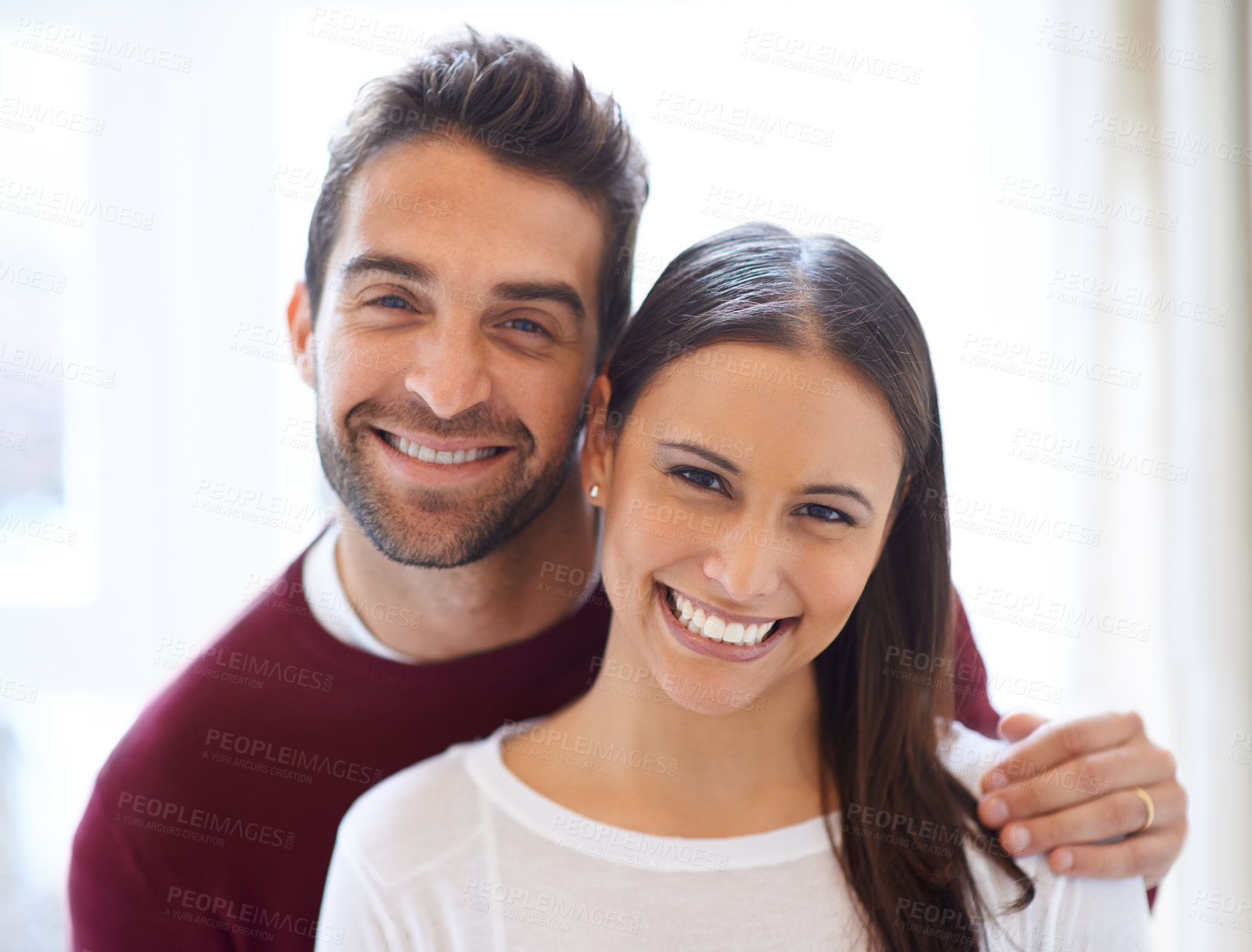 Buy stock photo Portrait, happy couple and hug in a house with love, trust and security, support or bonding at home together. Marriage, commitment or face of people in a living room with romance, care or gratitude