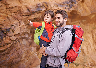 Buy stock photo Shot of a father and son enjoying a hike together