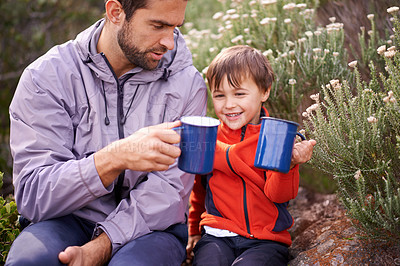 Buy stock photo Dad, child and camping mug with smile from hiking, travel and journey in nature with adventure. Backpack, youth and father with love, support and trust together outdoor with drink and cheers for fun