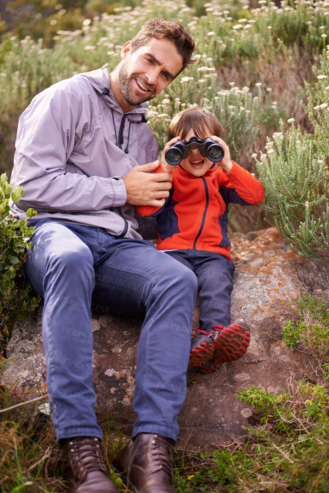 Buy stock photo Dad, child and camping binoculars with smile from hiking, travel and watching in nature with adventure. Backpack, youth and father with love, support and trust outdoor with a smile from walking