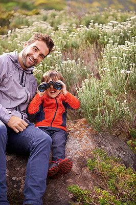 Buy stock photo Dad, child and binoculars with smile from hiking, travel and watching in nature with adventure. Parent, youth and father with love, support and trust outdoor with fun and view on trip with walking