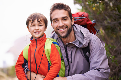 Buy stock photo Father, child and portrait with hiking, backpack and travel with smile and happy in nature. Kid, adventure and mountain with love, trust and bonding together with family and journey for holiday