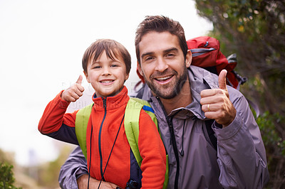 Buy stock photo Portrait of a father and son enjoying a hike together