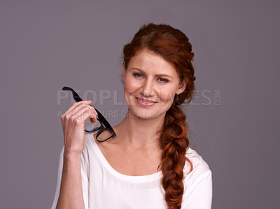 Buy stock photo Young woman, portrait and happy in studio with glasses for optometry choice, frame and confidence. Happy face of a young person or model smile with specs, eyewear or vision care on a gray background