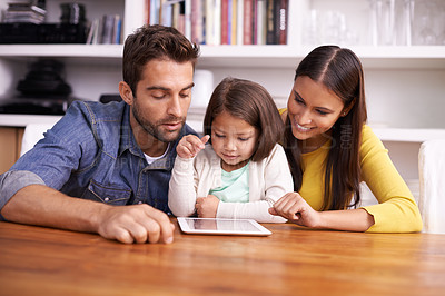 Buy stock photo Man, woman and child at table with tablet for teaching, learning and support in education with love. Elearning, digital app and parents with girl for help in homeschool, growth and development online