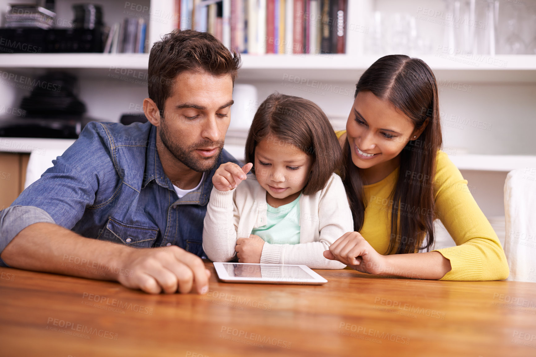 Buy stock photo Man, woman and child at table with tablet for teaching, learning and support in education with love. Elearning, digital app and parents with girl for help in homeschool, growth and development online