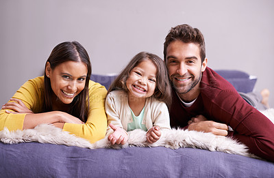 Buy stock photo Shot of a happy family in their bedroom