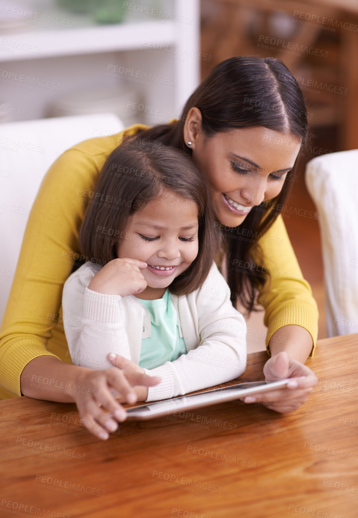 Buy stock photo Happy, home and mother with girl, tablet and bonding together with movies and connection. Smile, family and mama with daughter or relax with technology or internet with social media or online cartoon