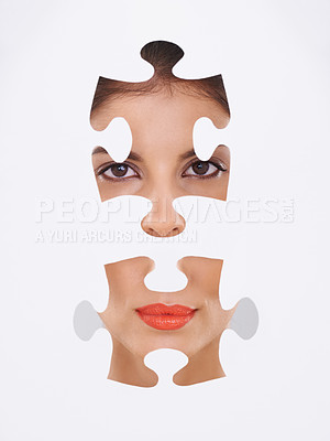 Buy stock photo Young woman, portrait and puzzle for makeup, cosmetics and dermatology transformation on a white background. Face of a beauty model with skincare repair, solution and facial aesthetic in a studio