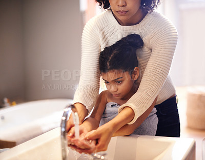 Buy stock photo Cleaning, water and washing hands by mother and child in a bathroom for learning, hygiene and care. Basin, wash and hand protection by mom and girl together for prevention of bacteria, dirt and germs