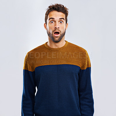 Buy stock photo Shock, portrait and male model in a studio with an amazed or surprise facial expression or attitude. Shocked, amazing news and man with a wtf, omg or wow face emoji isolated by a white background.