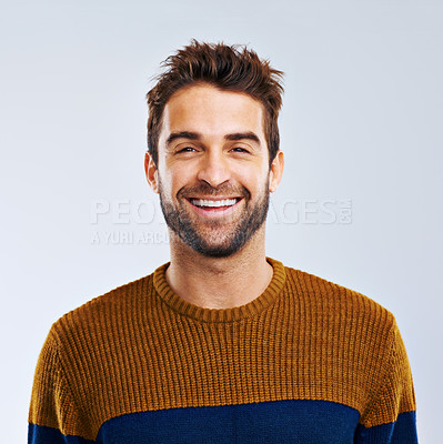 Buy stock photo Portrait, smile and man with positive, confidence and carefree against a grey studio background. Face, male person and human with a cheerful attitude, freedom and model with joy, Canada and relax