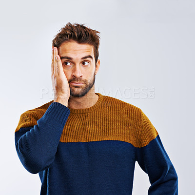 Buy stock photo Man, thinking and worry with stress, depression or anxiety in secret on a gray studio background. Young guy, model or upset male person in mistake, disappointment or mental health on mockup space