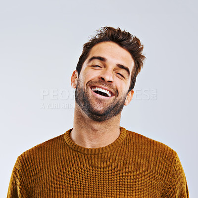 Buy stock photo Laughing, comedy and portrait of happy man by white background. Smile, confident and face laugh of comic person, isolated and young male model enjoying a comedy joke on a studio backdrop 