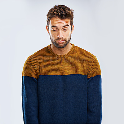 Buy stock photo Frustrated man, bored and down with stress, depression or anxiety on a studio background. Young, tired or upset male person or model with mood, disappointed or mental health breakdown on mockup space