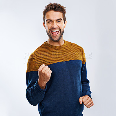 Buy stock photo Portrait, cheering and man excited, celebration and winning with guy isolated against a studio background. Face, male and happy person with fist, winner and excitement with happiness and victory