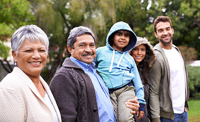 Buy stock photo Big family, smile and portrait in park with kid, parents and grandparents with love, care or happiness. Group, senior people and child with bonding, walking and diversity in garden, nature on holiday