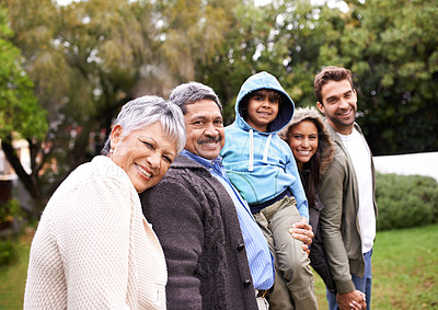 Buy stock photo Big family, portrait and generations in park with kid, parents or grandparents for love, care and happiness. Group, senior people and child for bond, walking and support by trees, nature or holiday