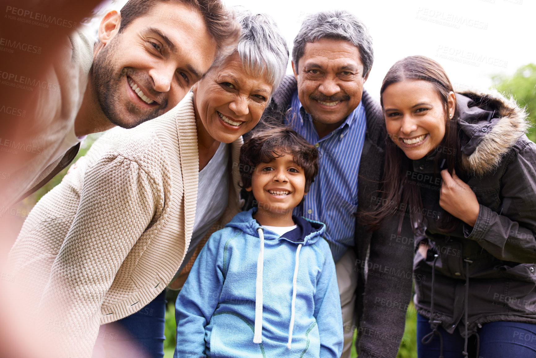 Buy stock photo Selfie, love and portrait of a big family on an outdoor adventure, travel or journey together. Happy, smile and boy child taking picture with his grandparents and parents while on holiday or vacation
